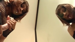 Redhead Ladyboy In dark lingerie Sucks A vibrator By The Mirror